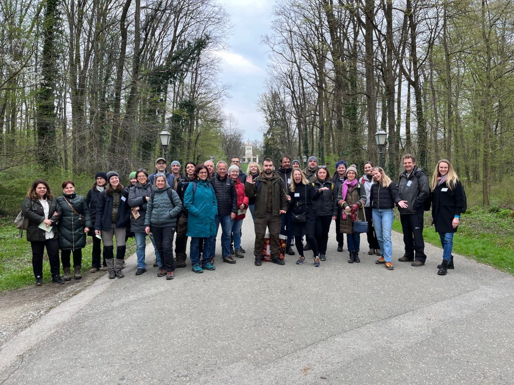 Group picture of 28 people standing in a park-like area of the urban Zagreb Forest, Maksimir Park